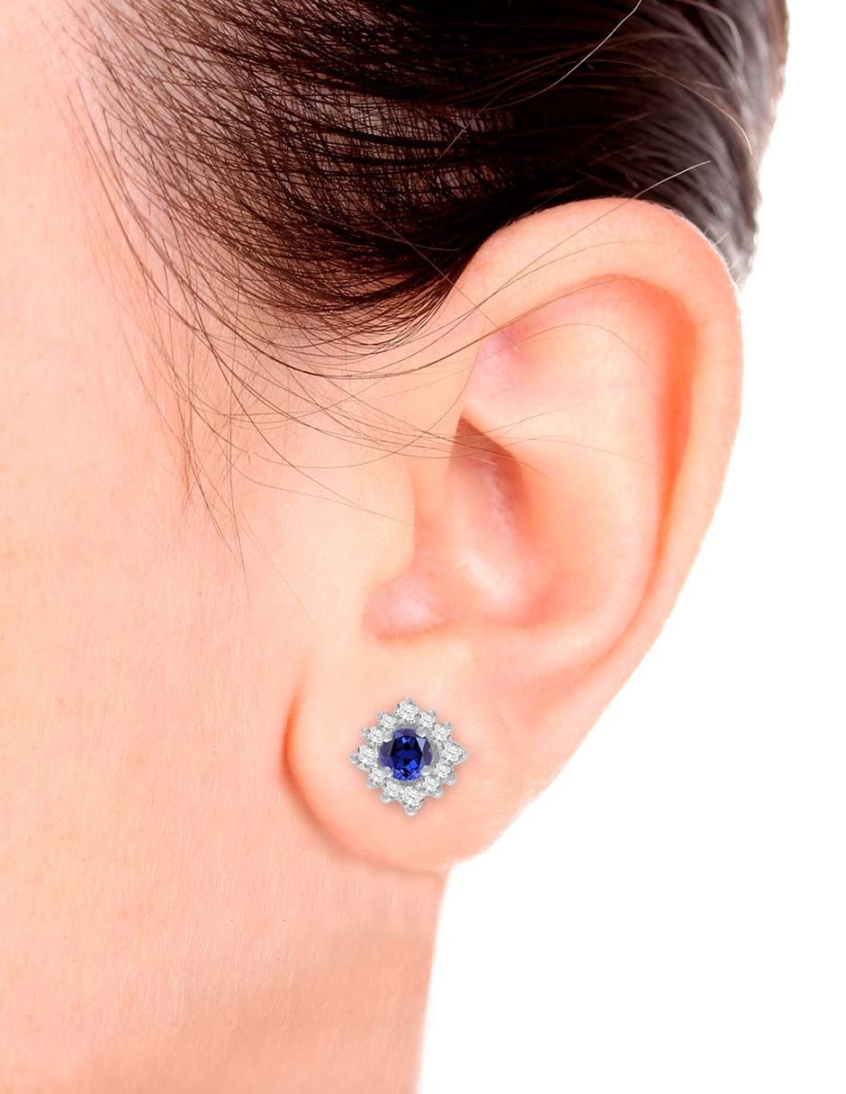 Aretes de flor Fascinare de oro blanco 14 K con acabado espejo zafiro y diamante Aretes de flor Fascinare de oro blanco 14 K con acabado espejo zafiro y diamante