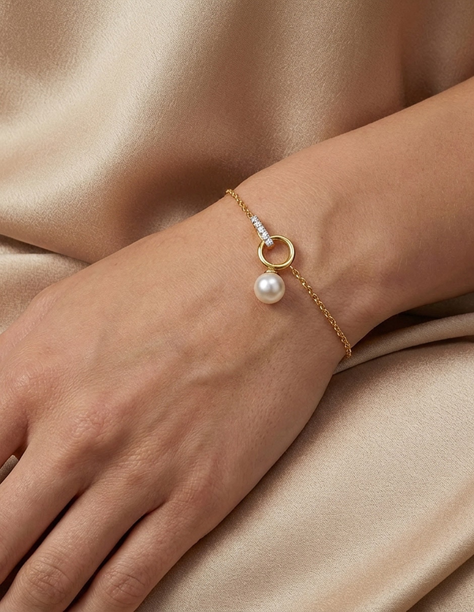 Pulsera de oro con perla 14 K acabado brillante