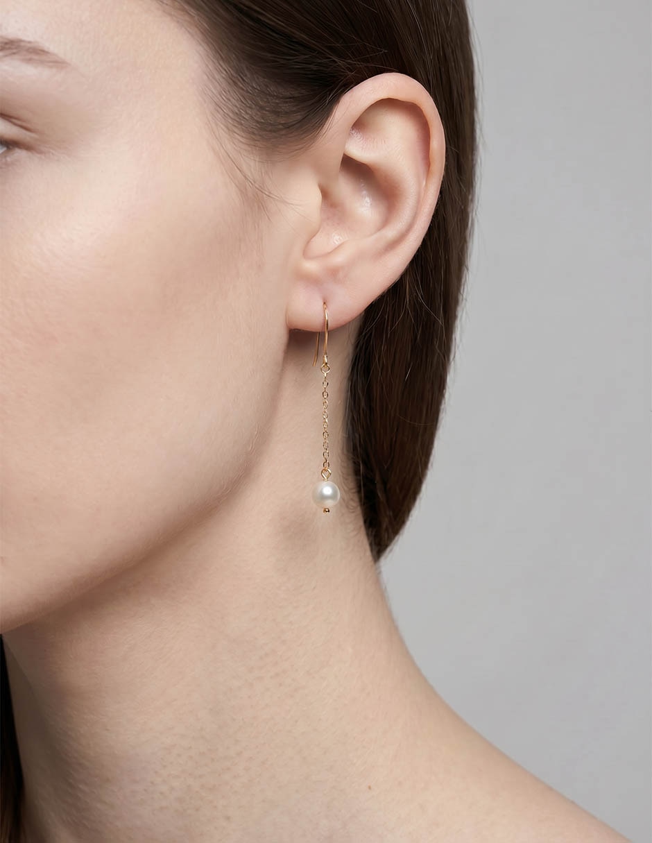 Aretes largos de oro amarillo 14 K con acabado brillante
